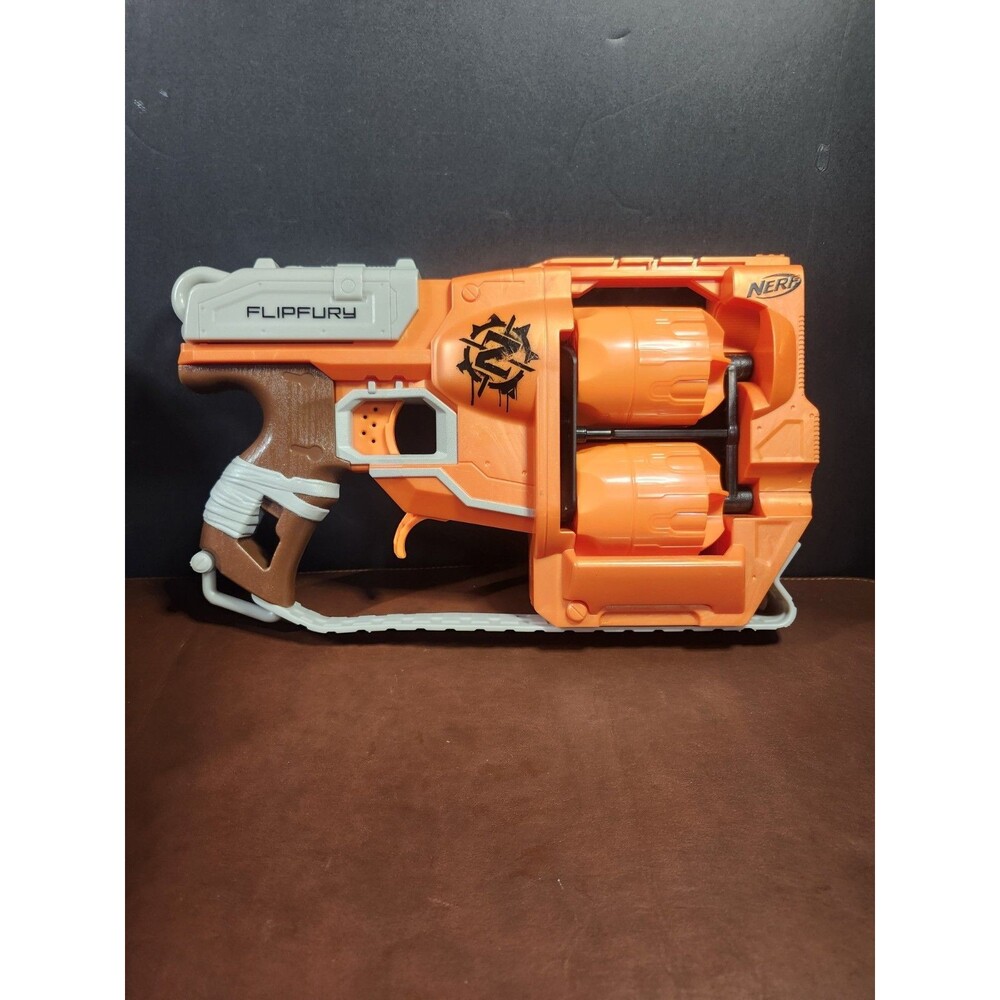 Nerf Zombie Strike FlipFury blaster, featuring two rotating 6-dart drums for...